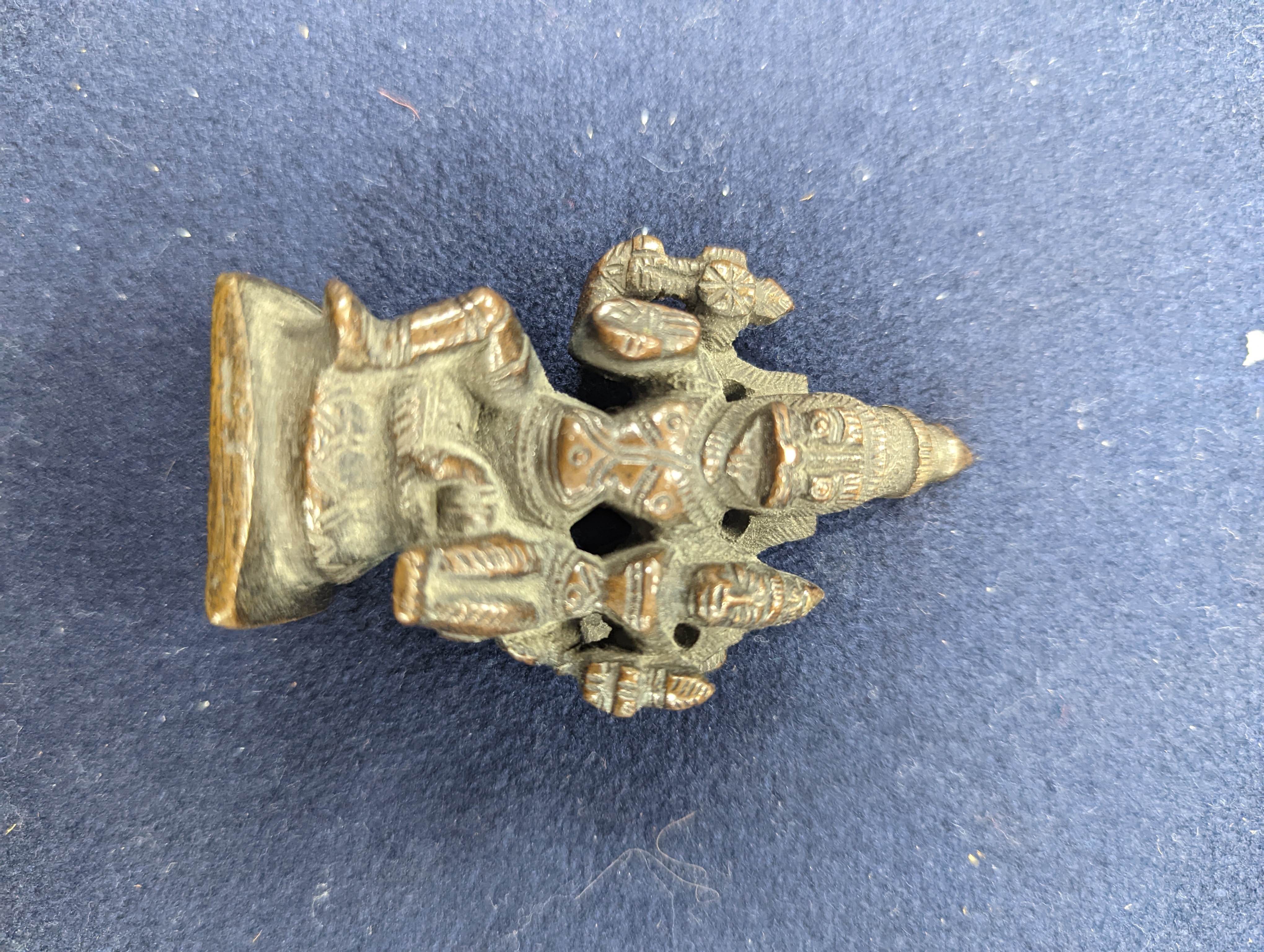 A Chinese gilt copper figure, a Chinese Dog of Fo, a bell, a censer, six Indian bronze figures and a scroll box